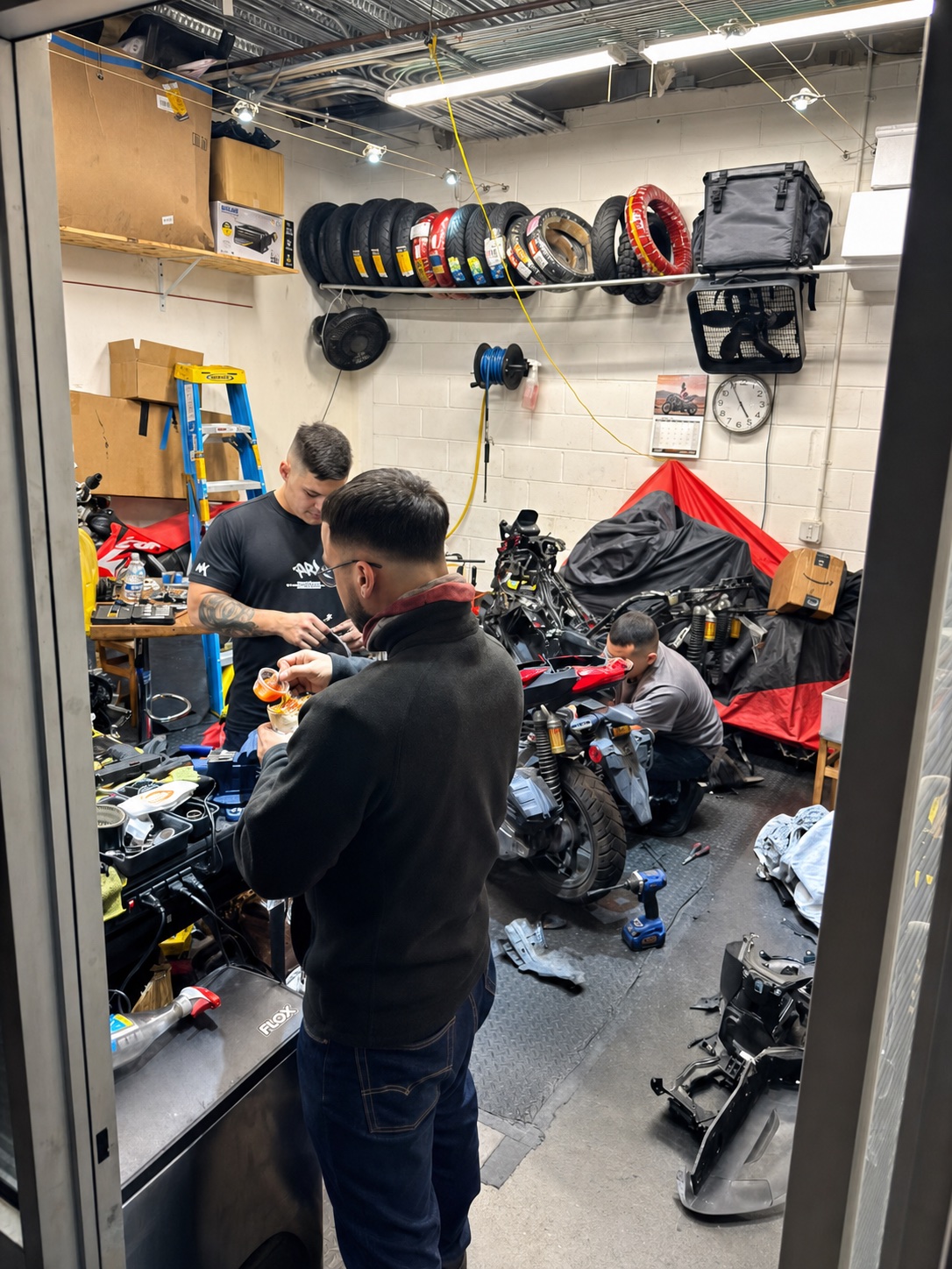 Real Facts team working on multiple scooters inside the workshop