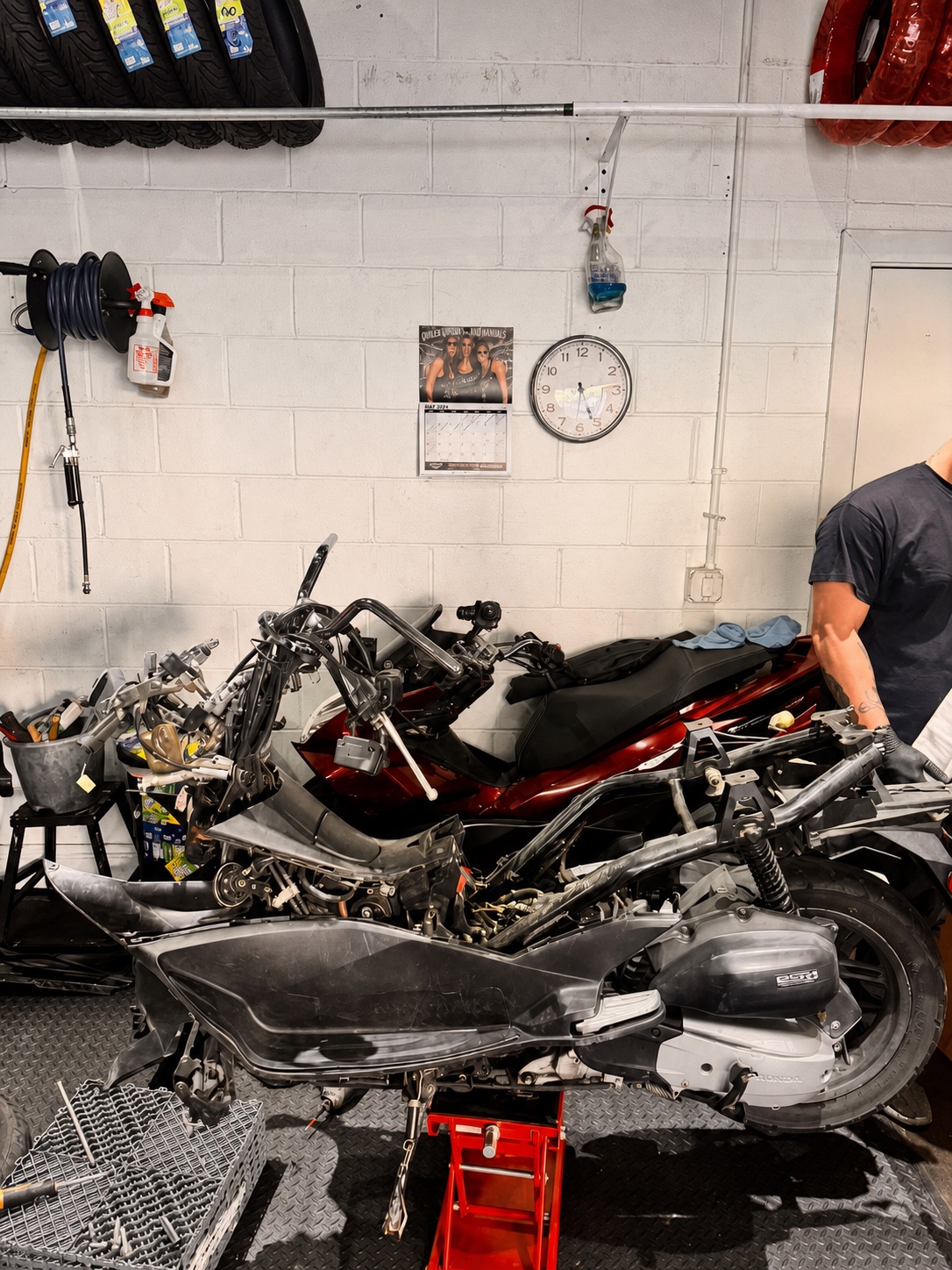 Disassembled scooters undergoing mechanical service at Real Facts